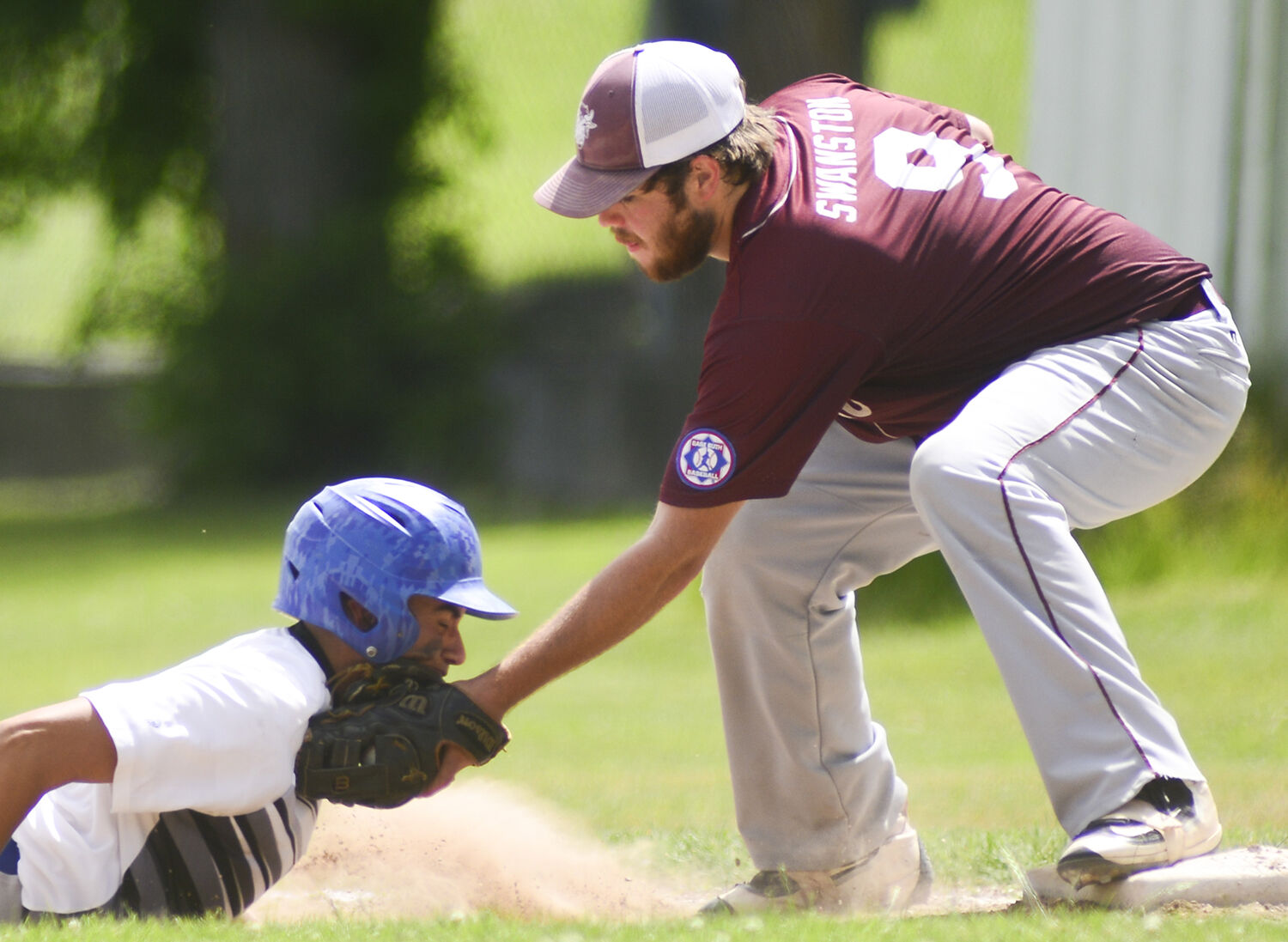 Nathan Swanston successfully tags out a runner after a fly out